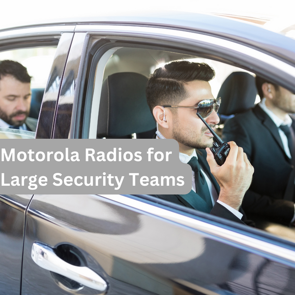 Security team transporting a client in a car. Front seat passenger is using a Motorola Two Way Radio. Text overlay: 