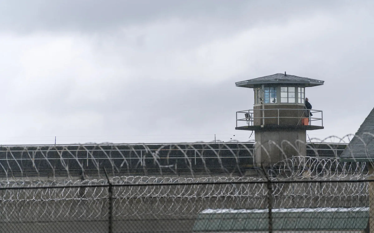 Guard tower and layered security fencing at a United States federal prison
