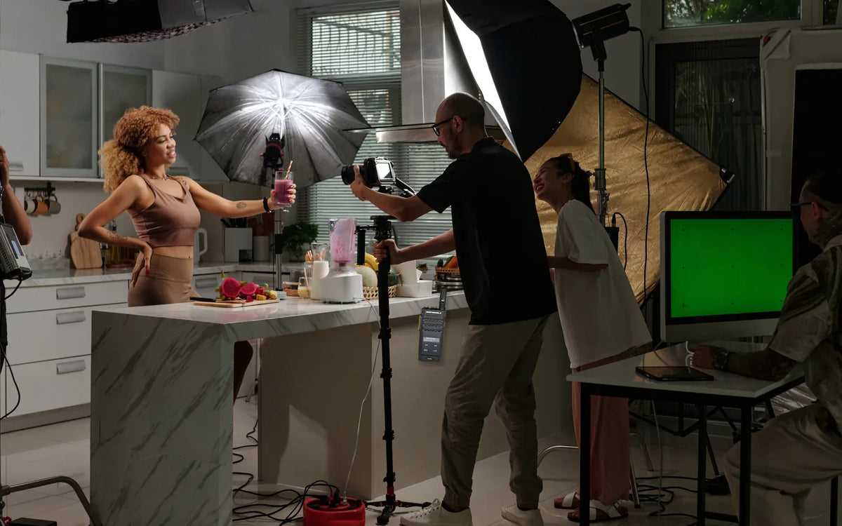 Film production crew recording a studio scene with a slim Motorola SL3500e radio clipped to the camera operator