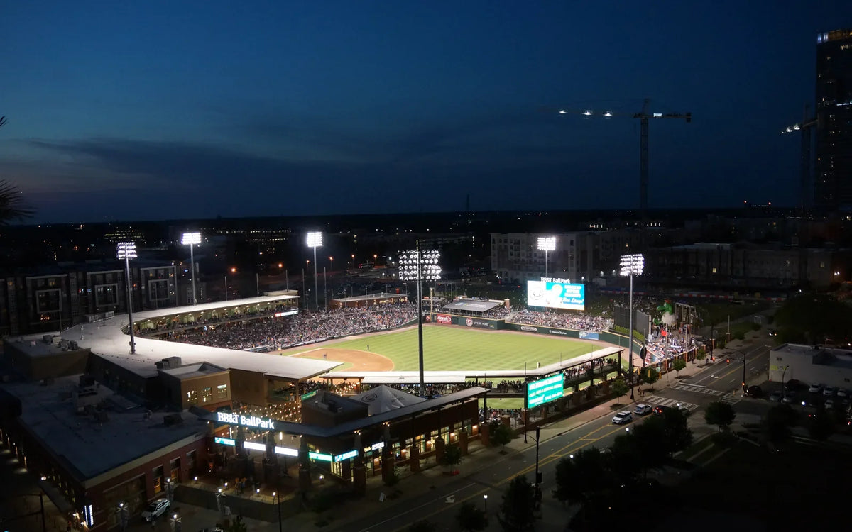 Night baseball game under stadium lights in the United States